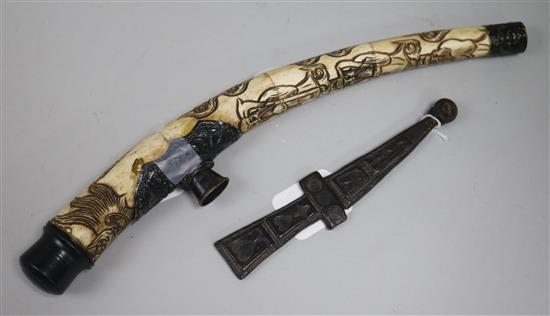 A Chinese figure-carved segmented bone opium pipe, white metal mounts and a Skean Dhu style knife in leather scabbard